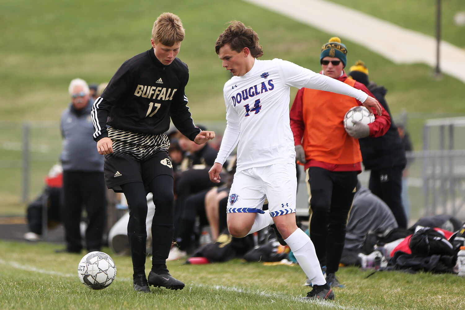 Lane Boden stops the ball and run of Douglas junior Mason Miller